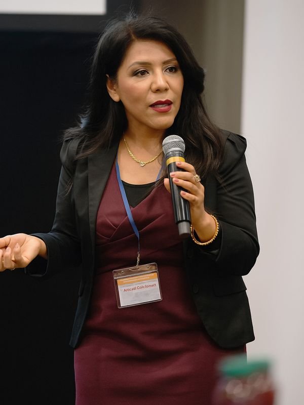 Araceli giving a public speech at a conference